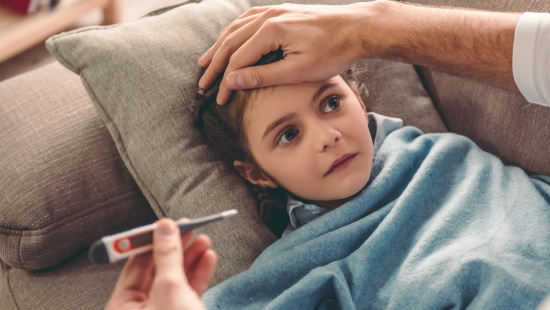 a cute girl baby undergoing the flu diagnosis 