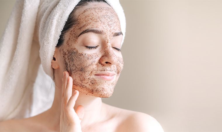 A Girl with Exfoliating Scrubs on her face